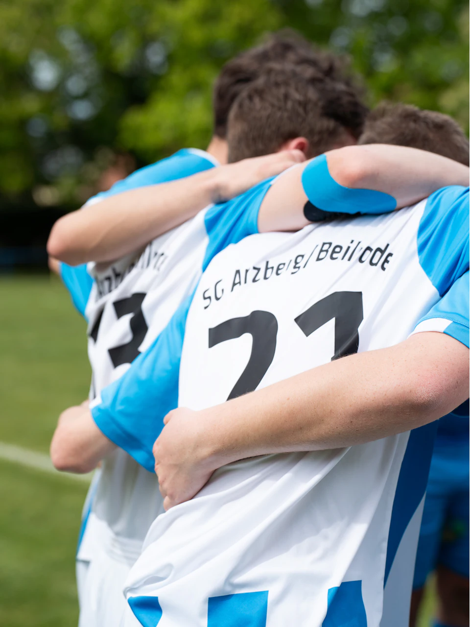 Teammates hugging after a win